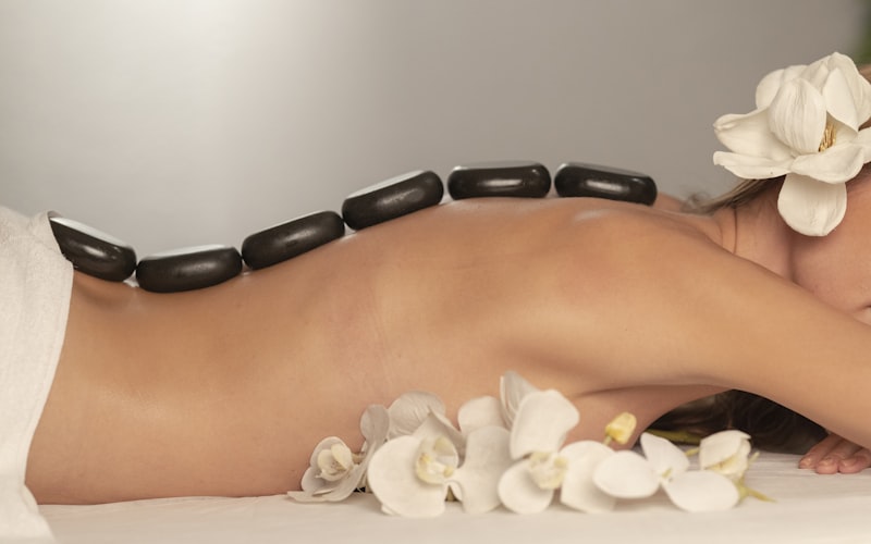Comfortable and relaxing massage chair in a dark, calming premium gym spa area.