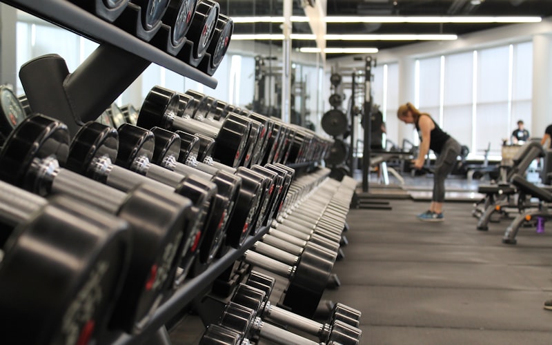 Inspiring gym member working out and smiling at Planet Fitness